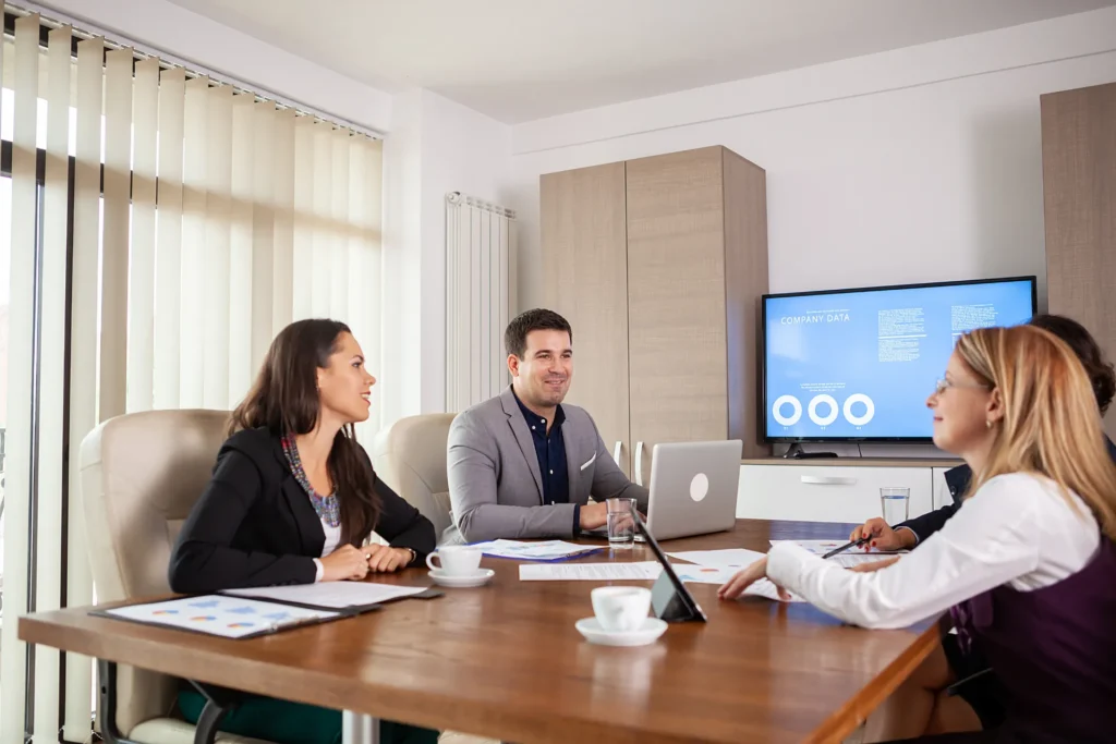 Brainstorming meeting of workers in conference room