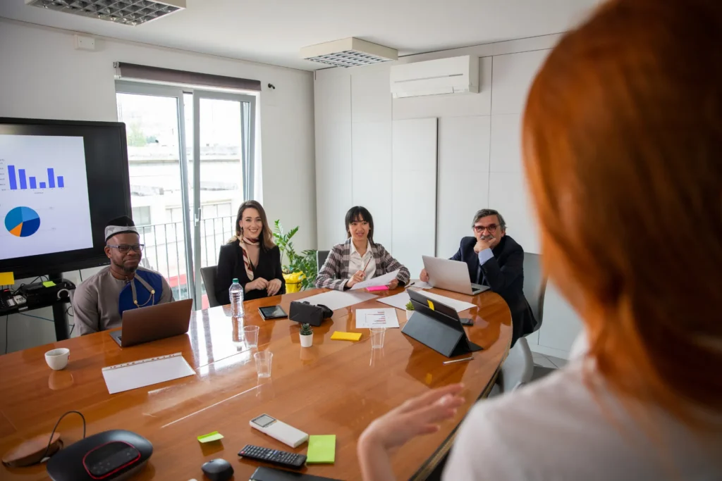 Business woman using network and conference room to deliver presentation