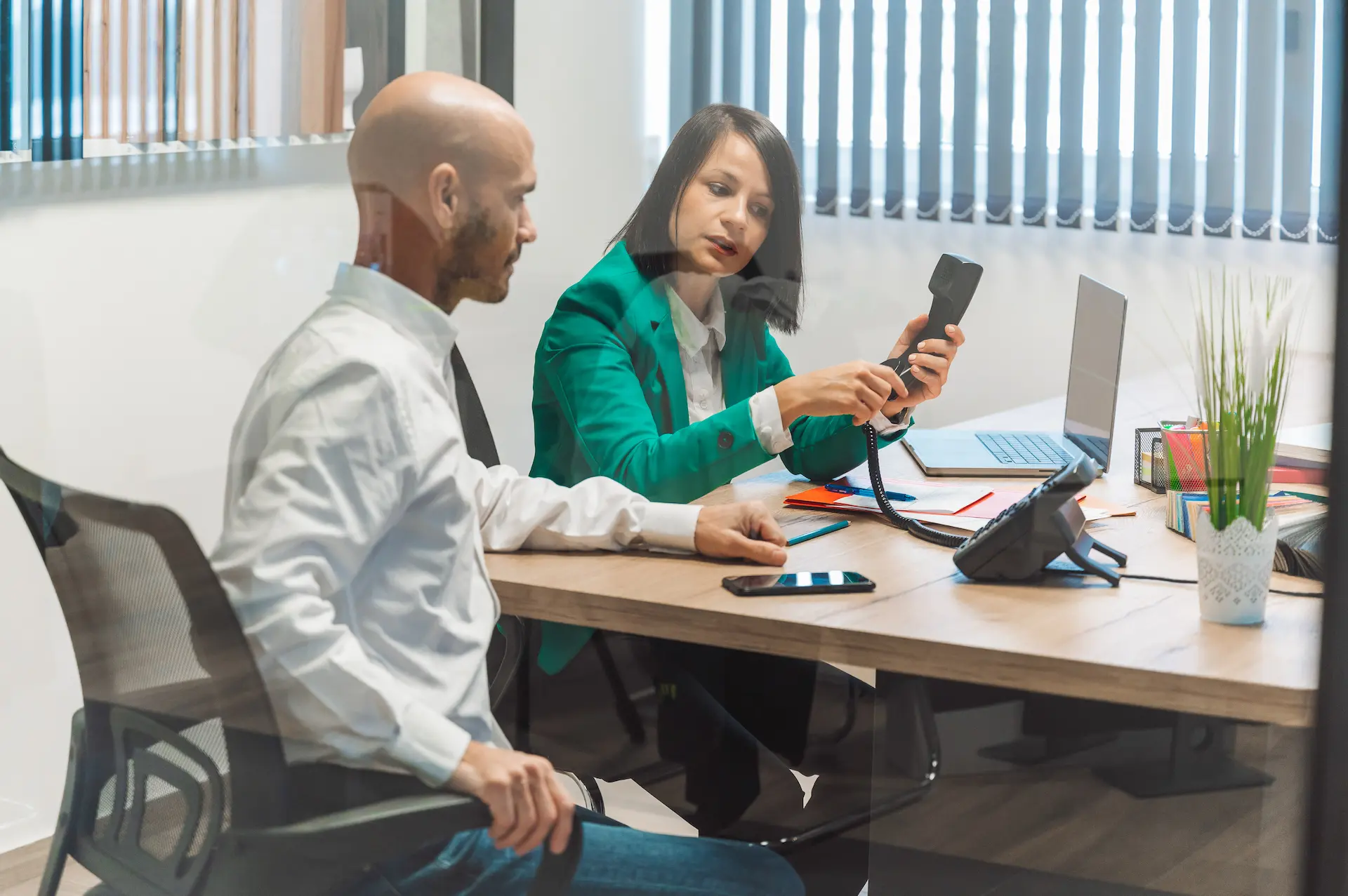 Man and woman discussing phone and internet services